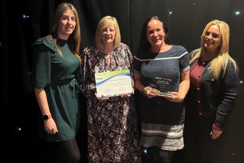 Claire Pilsbury, Jo O’Sullivan (holding the award certificate), Deanna Mezen (holding the trophy) and Kelly Ward