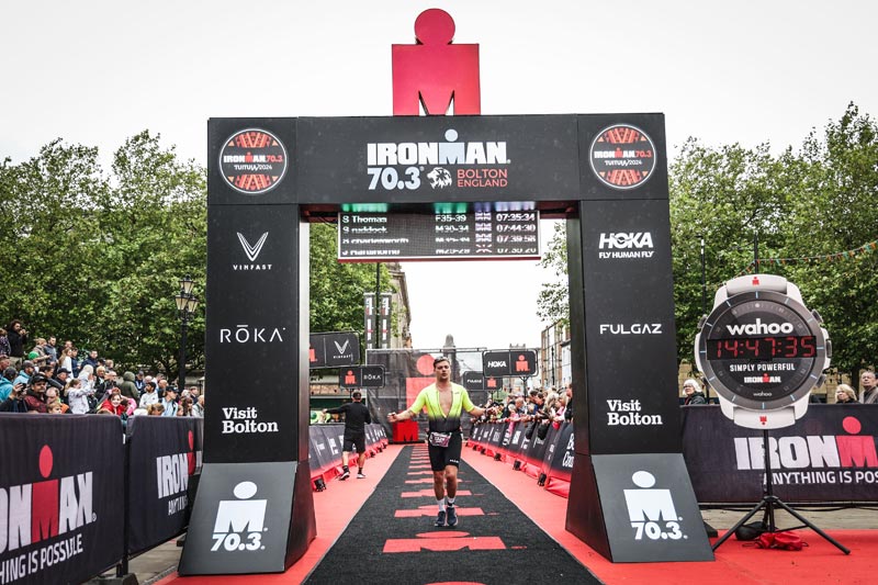 Joe Hartshorne crossing the finish line