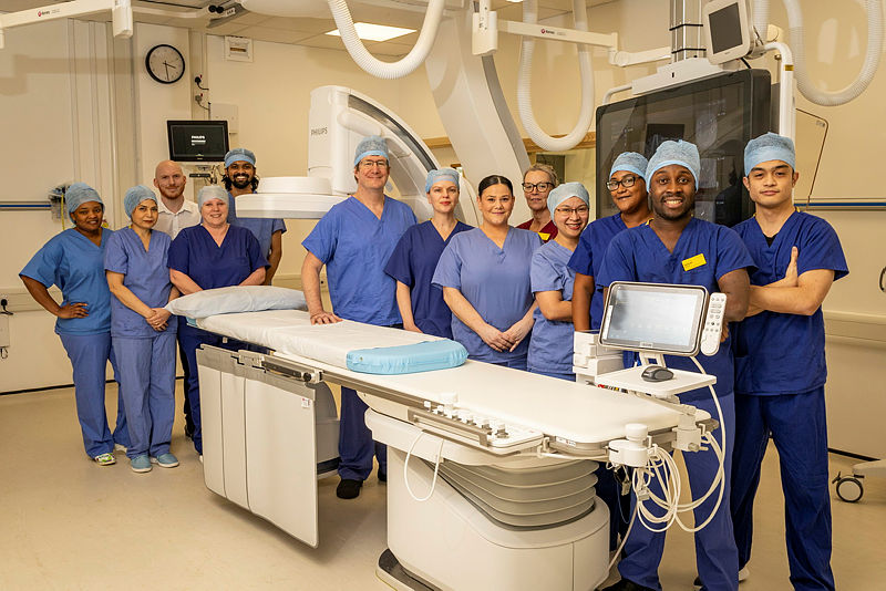 Latest News: Staff with new C-arm scanner